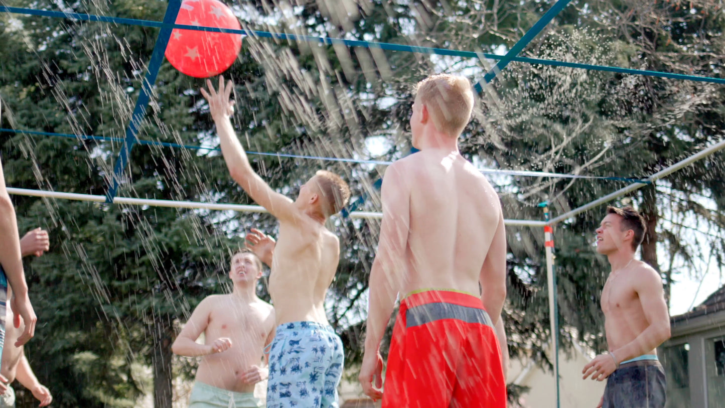 Guys hitting a red 9 Square ball while splash pad is active